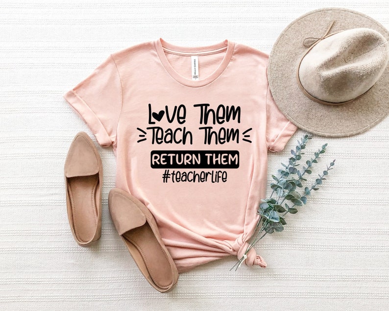 May include: A pink t-shirt with a black graphic that says "Love Them Teach Them Return Them #teacherlife".