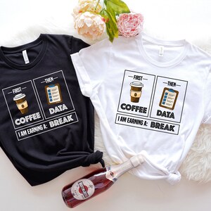 May include: Two t-shirts with a graphic design of a coffee cup and a checklist. The text on the shirts reads "First - Coffee, Then - Data. I am earning a: Break."
