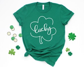 May include: Green t-shirt with a white shamrock and the word "lucky" written in cursive.