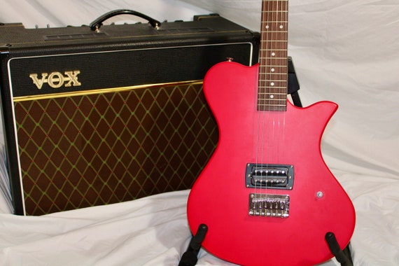 Red Electric Guitar First Act Model picture
