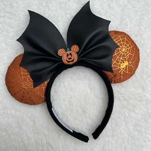 Spider web ears with bat bow