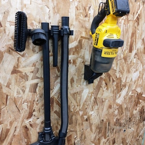May include: A yellow and black cordless vacuum cleaner with a hose and attachments hanging on a wall. The vacuum cleaner is labeled "DEWALT" and "20V MAX". The text "Vacuum & Attachments Not Included" is at the bottom of the image.
