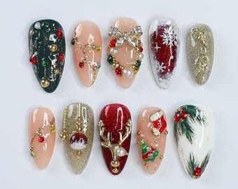 May include: Ten Christmas-themed nail designs featuring various festive elements like reindeer, ornaments, snowflakes, and Christmas trees. The nails are painted in shades of red, green, gold, and white.