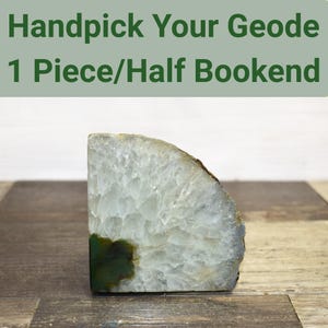 May include: A handmade, wooden cutting board with a natural finish. The rectangular board features a juice groove and a handle. Dimensions are approximately 18 inches long, 12 inches wide, and 0.75 inches thick.