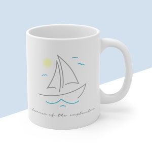 May include: White ceramic mug with a gray line drawing of a sailboat on a blue sea with a yellow sun and blue birds. The text "...because of the implication." is printed below the image.
