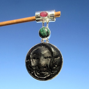 Sun and moon carved from buffalo horn, pendant in 925 silver with malachite and ruby
