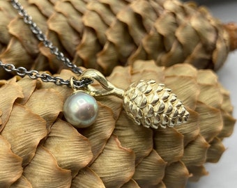 Solid pine cone pendant made of 585 yellow gold with an enchanting small Tahitian pearl - on a blackened cable chain
