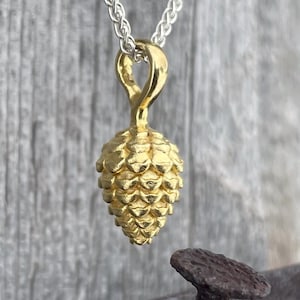 900 gold pine cone pendant - solid heavy pine cone made of 22 carat gold with a braided chain from the goldsmith