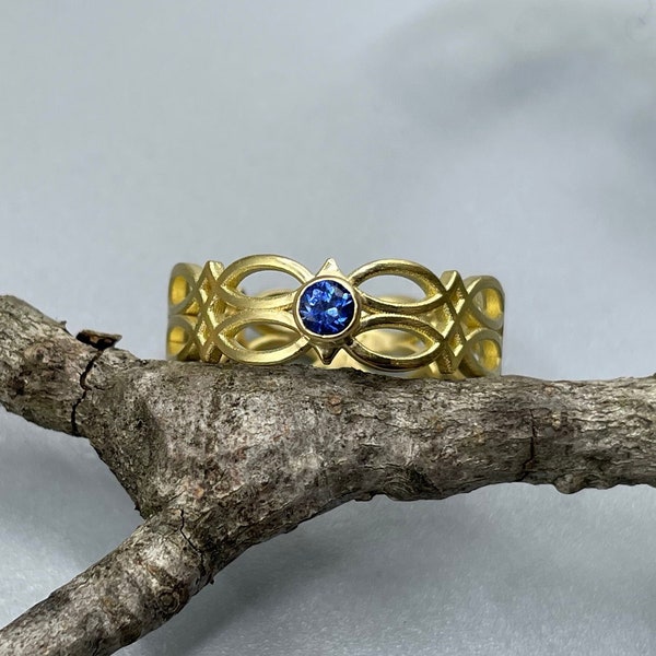 750 yellow gold band ring - Celtic love knot - with Ceylon sapphire - 18 carat