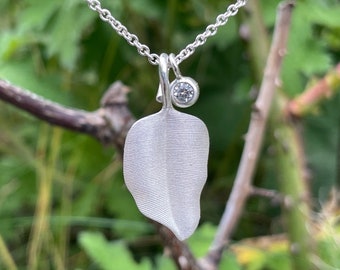 925 silver leaf pendant - finely engraved - with a natural white sapphire on a delicate cable chain