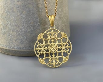 750 yellow gold amulet - large love knot pendant from a goldsmith, made of solid 18 karat gold on a silver anchor chain