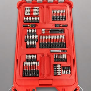 May include: A red plastic tool bit organizer insert with multiple molded compartments containing various metal screwdriver bits and extensions. The text at the bottom reads: INSERT ONLY - NO TOOLS - NO BATTERY - NO BOX. The organizer has a clear lid.