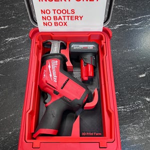 May include: A red and black Milwaukee FUEL sawzall and battery in a red case. The case has a clear lid with the text "INSERT ONLY, NO TOOLS, NO BATTERY, NO BOX". The case also has the text "3D Print Farm".