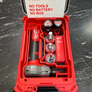 May include: A red and black Milwaukee Fuel tool kit containing a power tool and various attachments. The kit is housed in a red plastic case, with a label on the lid stating "INSERT ONLY. NO TOOLS, NO BATTERY, NO BOX." The case is designed to hold the tools securely.