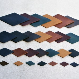 May include: A collection of leather squares in various colors, including brown, tan, dark green, and navy blue. The squares are arranged in rows, with the largest squares at the top and the smallest squares at the bottom.