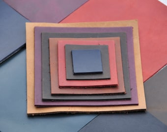 May include: A stack of seven leather squares in various shades of brown, red, and purple. The squares are arranged in a pyramid shape, with the smallest square at the top and the largest square at the bottom.