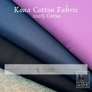 May include: Three fabric swatches of Kona Cotton Fabric, 100% cotton, in purple, navy blue, and black. The text "3 Solids" is visible in the image.