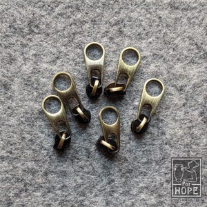 ANTIQUE GOLD BRONZE Zipper Pull, size 3 | 25, 10, 5, & 1 Count | Bag Making Sewing Supplies | Nylon | Round Pull Pop Tab | Brushed