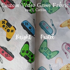 May include: Two fabric swatches with a repeating pattern of video game controllers. The left swatch features bright colors, while the right swatch features pastel colors. The text "Custom Video Game Fabric 100% Cotton" is at the top of the image. The text "Bright" is below the left swatch and the text "Pastel" is below the right swatch. The text "For Hope Waco Texas" is at the bottom of the right swatch.