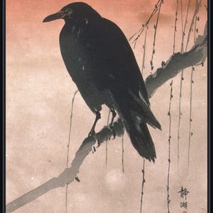 May include: A framed print of a black crow perched on a branch, rendered in a traditional Japanese style. The artwork features a muted color palette with a soft, peach-colored background and delicate lines.