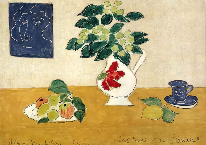 May include: A still life painting featuring a white jug with red flowers, a blue and white teacup and saucer, a plate of fruit, and a blue portrait of a woman. The painting is titled "Lierre en fleurs".