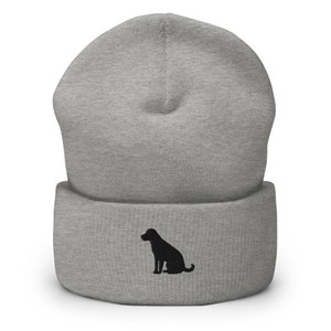May include: Gray beanie with a black silhouette of a dog sitting on the front.