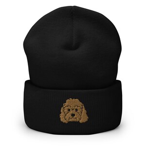 May include: Black beanie with a brown embroidered poodle on the front.