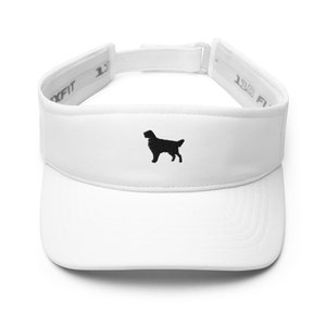 May include: White visor with a black silhouette of a dog embroidered on the front. The visor has a white adjustable strap with black text that reads "1 Size Fits All".