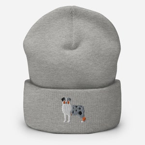 May include: Grey beanie with a blue merle Australian Shepherd embroidered on the front.