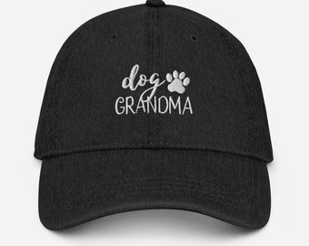 May include: Black baseball cap with white embroidery that reads "dog grandma" with a paw print.