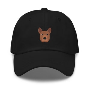 May include: A black baseball cap with an embroidered brown dog face.
