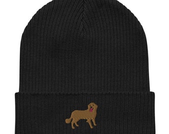 May include: Black knit beanie with a brown embroidered dog design. The dog is facing right and has its tongue sticking out.