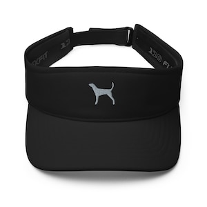 May include: Black visor with a grey embroidered dog silhouette. The visor has an adjustable strap with the text "110 FIT" on it.