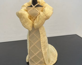 Miniature - off-white dress + cape on mannequin.