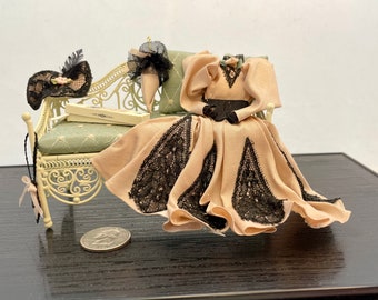 Miniature daybed with Victorian dress and lady's accessories
