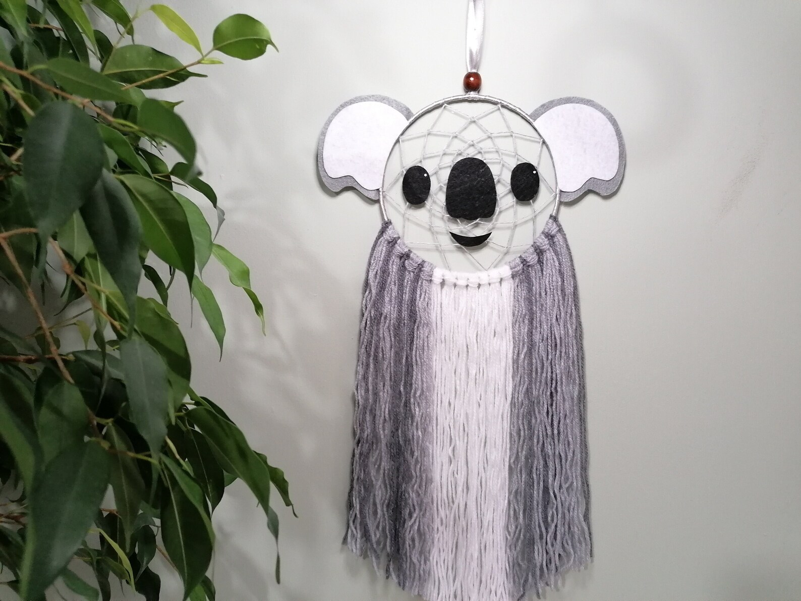 Dreamcatcher shaped like a koala bear face