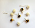 Handmade Wool Bee Garland - Whimsical Bumblebee Decor for Parties & Home product logo