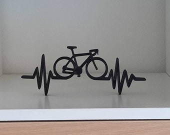 Heartbeat figurine with bicycle