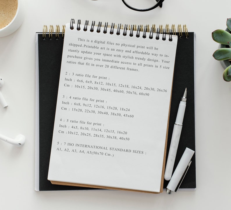 May include: A white sheet of paper with black ink handwritten text listing different print sizes in inches and centimeters. The text includes the ratios 2:3, 3:4, 4:5, and 5:7. The text also mentions ISO International Standard Sizes: A1, A2, A3, A4, and A5 (50x70 cm).