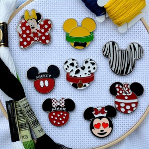 May include: Nine embroidered iron-on patches featuring various Disney characters, including Mickey Mouse, Minnie Mouse, Pluto, and Goofy. The patches are all in different colors and designs, and they are perfect for adding a touch of Disney magic to any project.