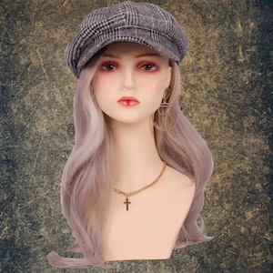 May include: A mannequin with long, wavy, light purple hair wearing a gray and white plaid newsboy cap, gold hoop earrings, and a gold chain necklace with a small cross pendant.