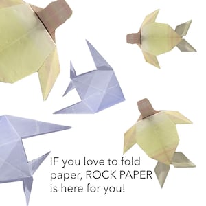 May include: Four origami figures, two yellow and two blue, are floating against a white background. The yellow figures are turtles and the blue figures are fish. The text "IF you love to fold paper, ROCK PAPER is here for you!" is at the bottom of the image.