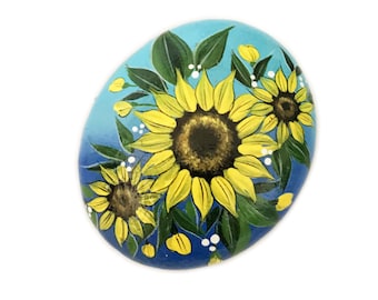 Steen met zonnebloemmotief, handbeschilderde steen, tuindecoratie met zonnebloemen, bloemenkunst op steen, beschilderde tuinsteen, natuurlijke woondecoratie, handgemaakt cadeau