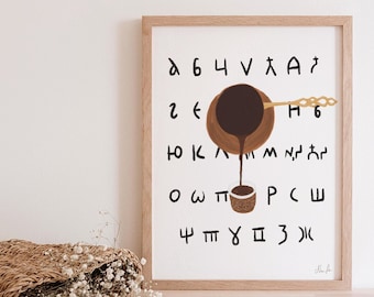 May include: A framed print with a white background and a brown illustration of a coffee pot pouring coffee into a cup. The illustration is surrounded by a grid of letters in a black font.