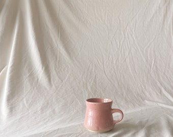 Handmade ceramic mug / light pink speckled glaze