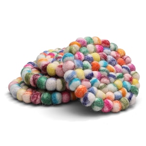 May include: Set of four colorful felt coasters, each made of small, round balls of wool in various shades of pink, blue, green, yellow, orange, and white.