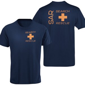 May include: A navy blue t-shirt with a white cross and the text "SEARCH RESCUE" on the front. The back of the shirt has the text "SAR" and "SEARCH RESCUE" with a white cross.