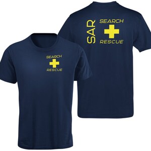May include: A navy blue t-shirt with a yellow cross and the text "SEARCH RESCUE" on the front. The back of the shirt has the text "SAR SEARCH RESCUE" in yellow.