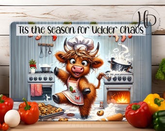 May include: A whimsical illustration features a cartoon cow chef in a kitchen setting. The cow, wearing a chef's hat and apron, is dancing near a stove. The image includes text that reads "Tis the season for udder chaos." Vegetables and cookies are also present.