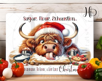 May include: A Highland cow wearing a Santa hat is covered in flour and sugar with the text "Sugar, Flour, Exhaustion... Beginning to Look a Lot Like Christmas".